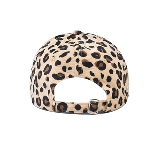 Detail view of leopard print baseball cap with adjustable strap and metal buckle closure