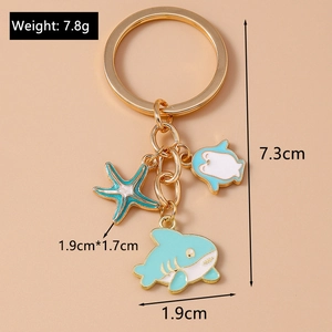 Detail showing dimensions of enamel shark and starfish keychain with weight 7.8g
