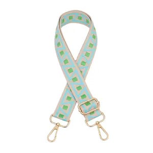 Adjustable woven handbag strap with geometric patterns and pale gold lobster clasps