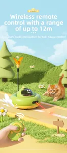 Smart green UFO cat toy with laser pointer and feather detail on a grass lawn