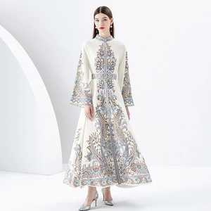 Floral paisley maxi dress with stand collar and bell sleeves on a white background