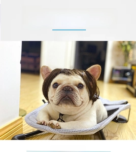 Funny dark brown bob wig for dogs shown on a bulldog relaxing on a grey pet cot