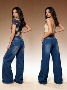 Detail of blue high-waisted wide-leg jeans showing back pockets and denim texture