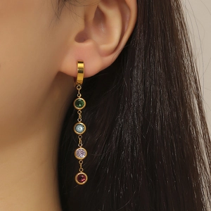 Titanium steel tassel drop earrings with four colorful gems worn by a model