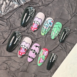 Halloween theme press-on nails with hand-painted spider webs, bats, and colorful monster motifs