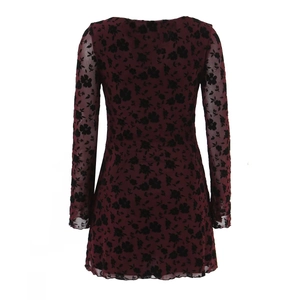 Burgundy long sleeve mini dress with black floral flocking and sheer mesh sleeves