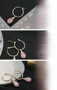 Detail of 18K gold plated earrings with pink crystal drop and natural freshwater pearl