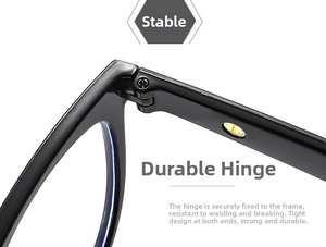 Detail of a durable metal hinge on a black acetate eyeglass frame with precise screws