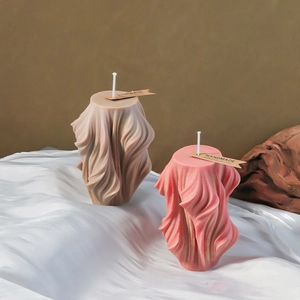 Spiral pleated pillar candle mold featuring unique fabric textures and handmade labels