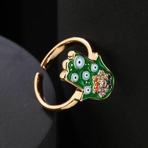 Golden Hamsa Hand open ring with evil eye detail and colorful zircons on black display