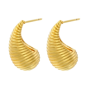 Vintage golden C-shaped hoop earrings with spiral ribbed texture and bold tapered design