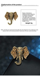 Detailed macro view of vintage elephant brooch with yellow rhinestones and gold finish