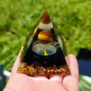 Macro shot of tiger eye stone and tree of life design inside an orgonite pyramid