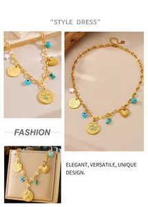 Macro detail of gold vintage necklace with hamsa hand, evil eye and heart charms