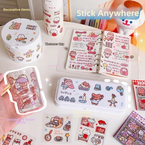 Detail of cute cartoon waterproof stickers applied on bottles and stationery items