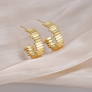 Minimalist C-shaped gold plated earrings with a ribbed textured finish for women