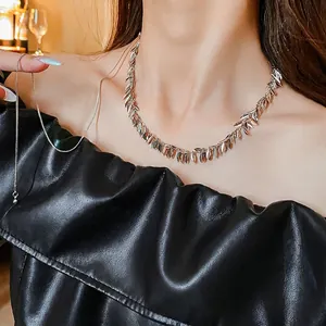 Silver metal sequin tassel choker necklace on model with modern luxury style