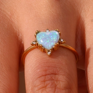 Detailed close-up of heart-shaped blue opal ring with 18K gold plating and crystal accents