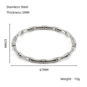Technical drawing showing the 5mm thickness and 57x67mm size of this bamboo steel bangle