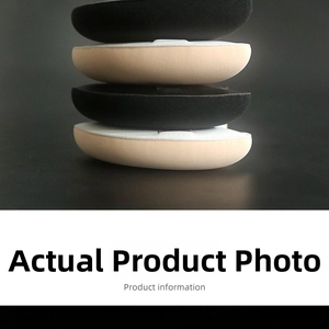 Macro detail of black and nude foam bra pads showing shape, thickness and soft texture