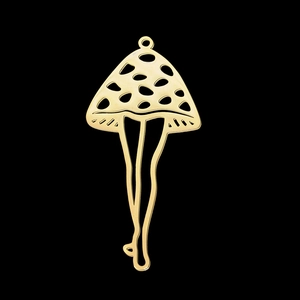 Macro shot of gold mushroom pendant with female legs design in polished stainless steel