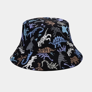 Detail shot of the black bucket hat showing colorful dinosaur print and fabric texture