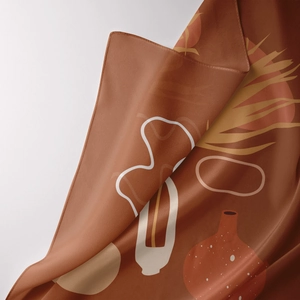 Detailed close-up of terracotta bohemian tapestry fabric with abstract leaf and vase prints
