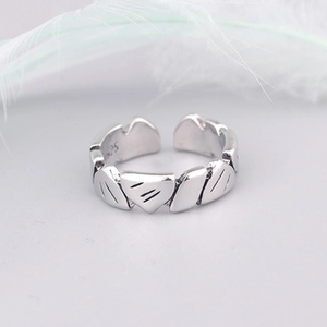 Detailed close-up of 925 sterling silver hallmark inside the leaf pattern open ring