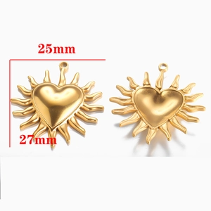Detailed view of gold heart-shaped sunburst pendant with 25mm x 27mm size dimensions