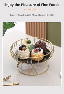 Single tier gold metal dessert stand with black marble base and vertical fence design