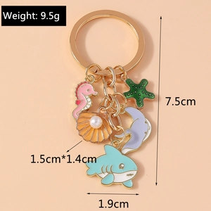 Detail view of marine theme keychain with precise dimensions of shell and shark charms