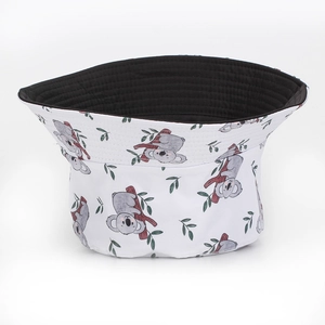 Detail of sloth print bucket hat featuring high-quality stitching and reversible black lining