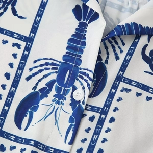 Women's two-piece casual set featuring blue lobster print on white V-neck shirt