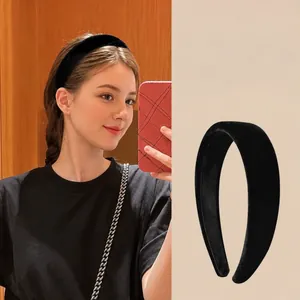 Classic wide black velvet headband for women with a minimalist vintage style accessory