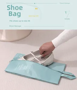 Waterproof sage green travel shoe bag with handle for storage of shoes up to size 44