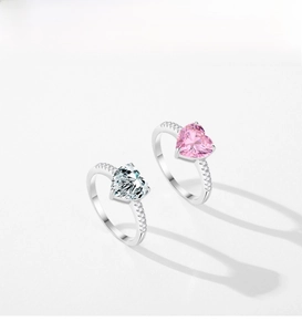 Detailed view of S925 silver rings with pink and white heart-shaped gemstones