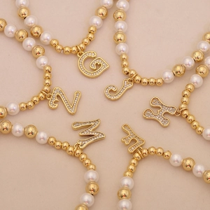 Fashion beaded alphabet bracelets with gold beads and sparkling crystal initial pendants