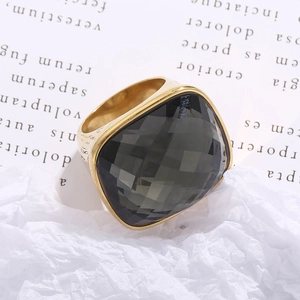 Detailed macro view of gray checkered square gemstone set in a vintage gold ring band