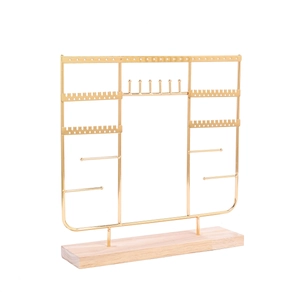 Gold metal jewelry stand with wooden base for necklaces, earrings, and bracelet display