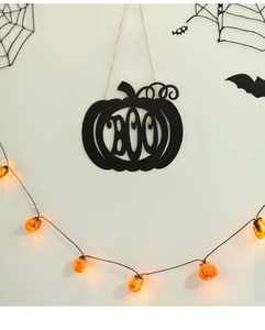 Detail of black BOO pumpkin door sign hanging with rustic twine for Halloween decor