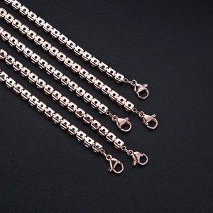Detail of rose gold tennis bracelets with square-cut colorful gemstones and lobster clasp