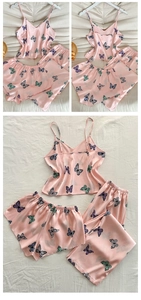 Detailed view of pink satin floral 3-piece pajama set including cami top, shorts and pants