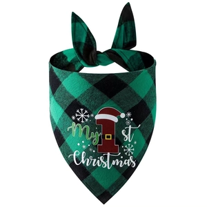 Detail of green buffalo plaid dog bandana with My 1st Christmas print and snowflakes