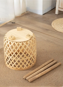 Detail of woven bamboo plant stand with detachable solid wood legs and metal screws