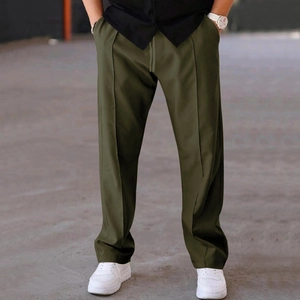 Detail of olive green straight-leg casual pants with drawstring waist and durable seam work