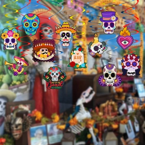 Detail of colorful Dia de Muertos skull hanging decorations with vibrant spiral swirls