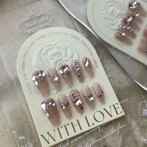 Handmade long coffin press-on nails with nude pink gradient, crystals and pearls