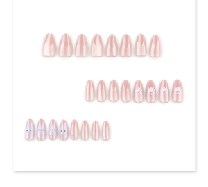 Detail of 24pcs nude pink almond press-on nails with cute cat paw and kitty face patterns