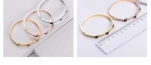 Detail showing inner diameter of 6cm for square gemstone bangles in three colors