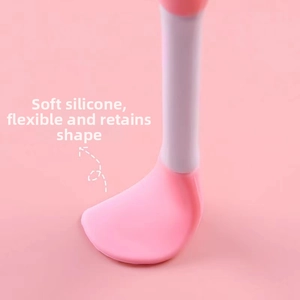Flexible pink soft silicone baby spoon head detail showing bendable and durable material